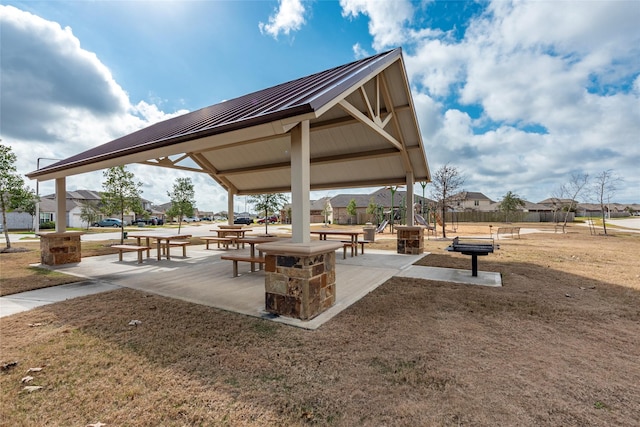 surrounding community with a yard and a gazebo