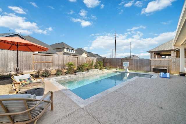 view of swimming pool with a patio area