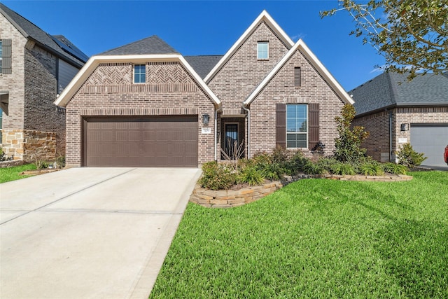 view of front of home with a garage, a front yard, concrete driveway, and brick siding