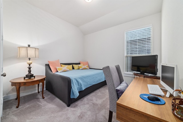 bedroom featuring vaulted ceiling and carpet flooring