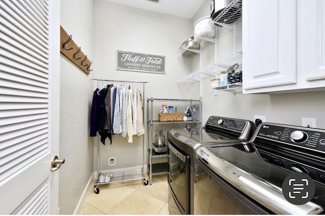 laundry room featuring washer and dryer, cabinet space, baseboards, and light tile patterned flooring