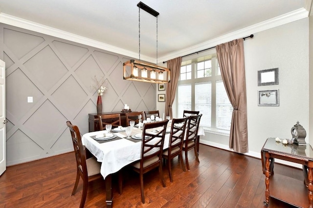 dining room with baseboards, dark wood-type flooring, and crown molding