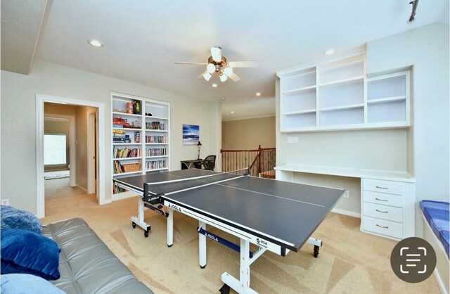 game room featuring light carpet, ceiling fan, built in shelves, and recessed lighting