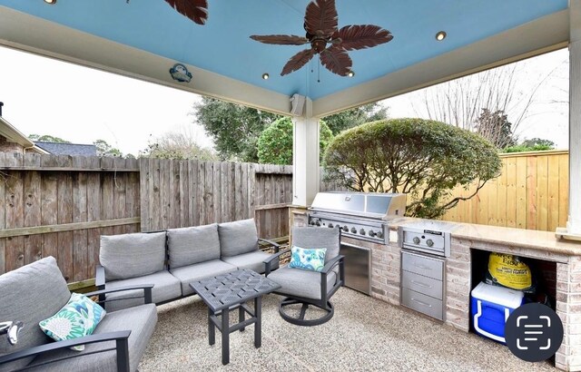 view of patio featuring a fenced backyard, an outdoor living space, a ceiling fan, and area for grilling