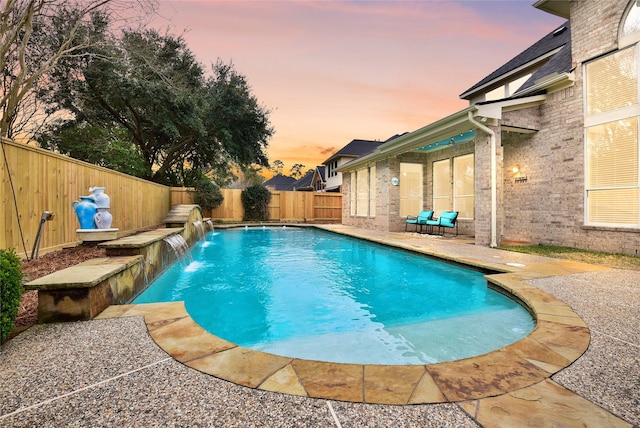 view of pool featuring a patio area, a fenced backyard, and a fenced in pool