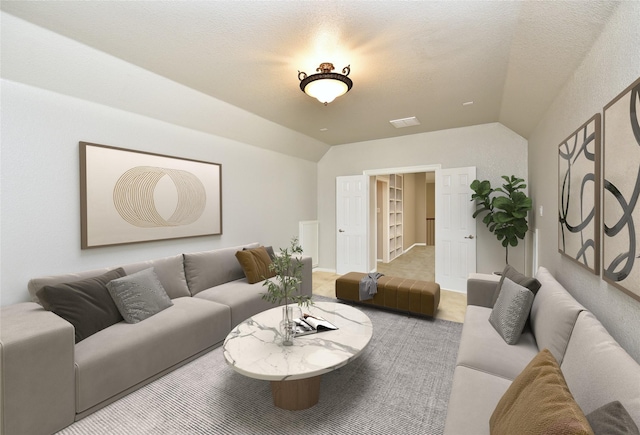 carpeted living area featuring lofted ceiling