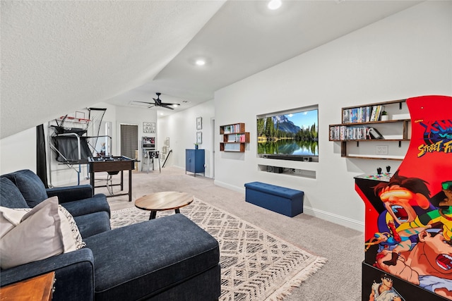 living room featuring baseboards, vaulted ceiling, carpet flooring, a textured ceiling, and a ceiling fan