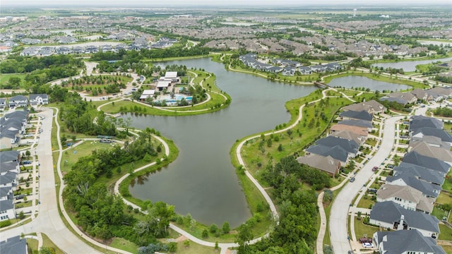 drone / aerial view featuring a residential view and a water view