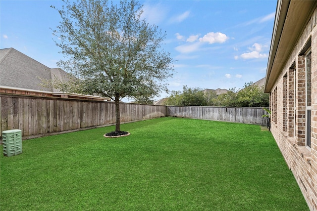 view of yard featuring a fenced backyard