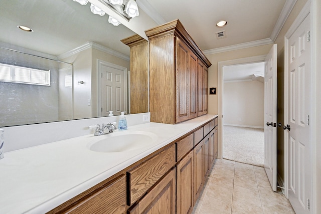 bathroom with tile patterned floors, ornamental molding, and vanity