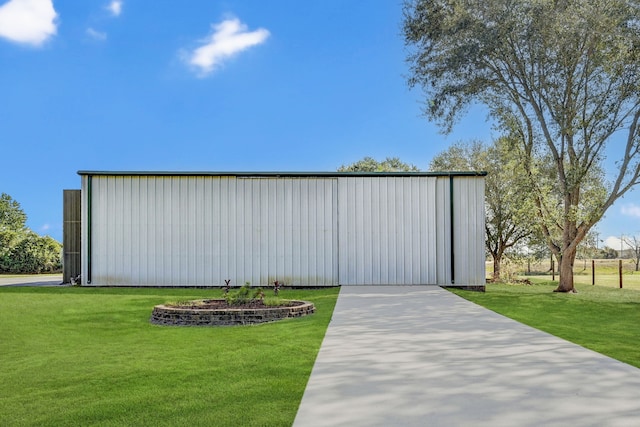 view of outbuilding featuring a yard