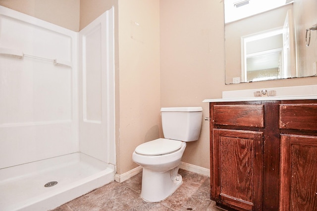 full bath featuring toilet, visible vents, vanity, baseboards, and a stall shower