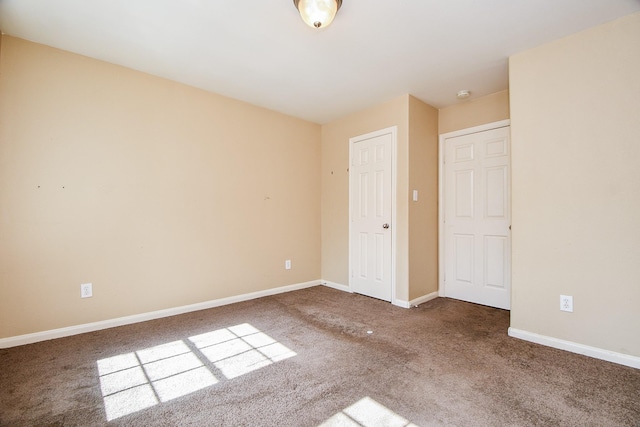 unfurnished bedroom featuring carpet