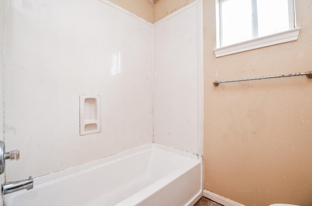 bathroom with washtub / shower combination