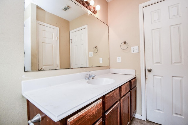 bathroom featuring visible vents and vanity