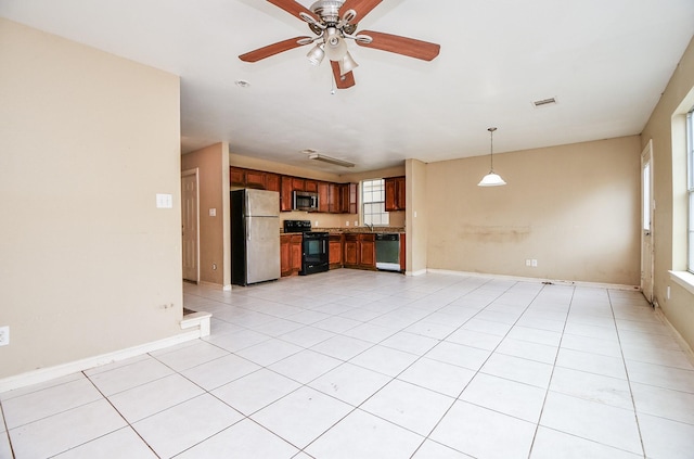 unfurnished living room featuring sink, light tile patterned floors, and ceiling fan