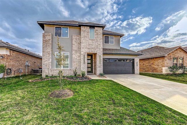 view of front of house with a garage, central AC, and a front yard