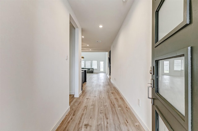 corridor featuring light hardwood / wood-style flooring