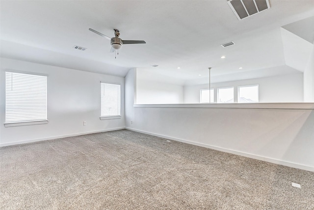 unfurnished room featuring ceiling fan, a healthy amount of sunlight, and carpet flooring