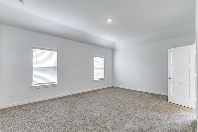 unfurnished room featuring carpet