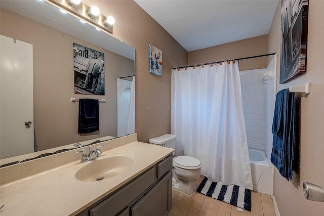 full bathroom featuring shower / tub combo with curtain, tile patterned flooring, vanity, a textured ceiling, and toilet