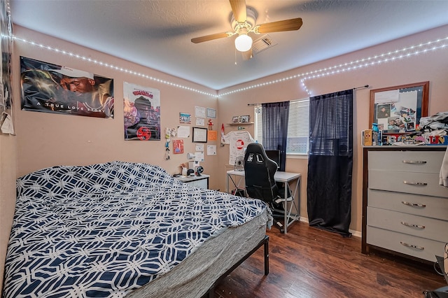 bedroom featuring dark hardwood / wood-style floors and a textured ceiling