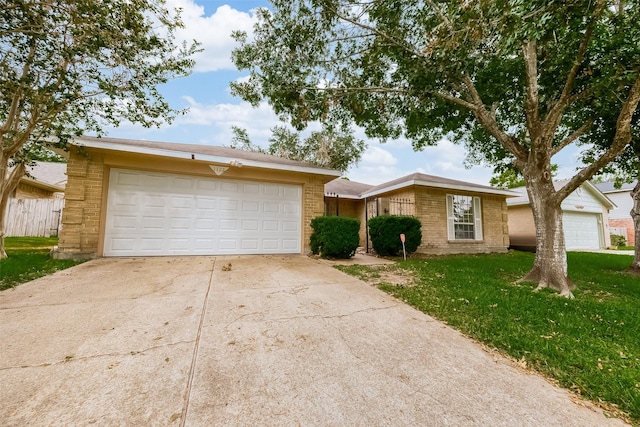 ranch-style home with a garage and a front yard