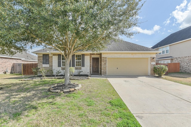 view of front of property featuring a garage and a front yard