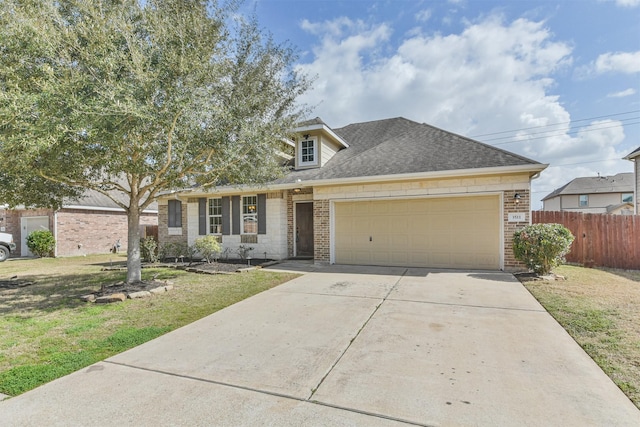 view of front facade featuring a garage and a front lawn