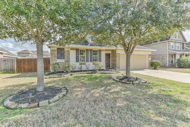 view of front of property with a garage and a front yard