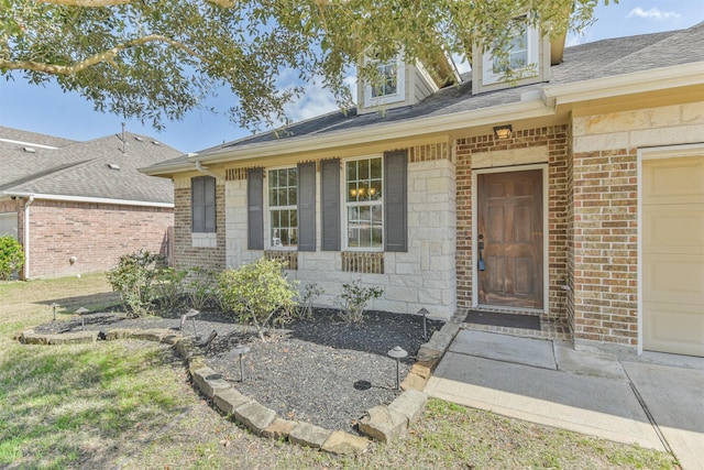 view of exterior entry featuring a garage