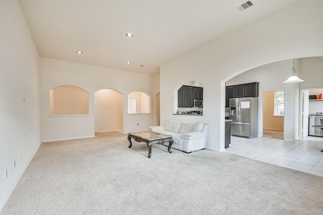 living room featuring light carpet