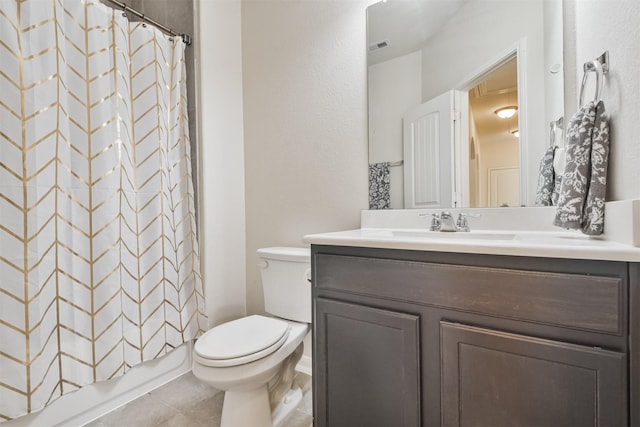 full bathroom featuring vanity, tile patterned floors, toilet, and shower / bath combo with shower curtain