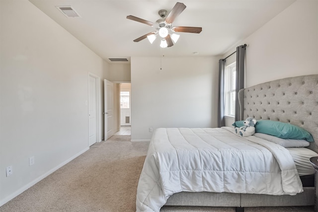 carpeted bedroom with ceiling fan