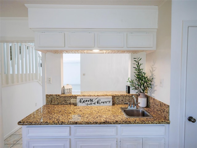 kitchen with sink and ornamental molding