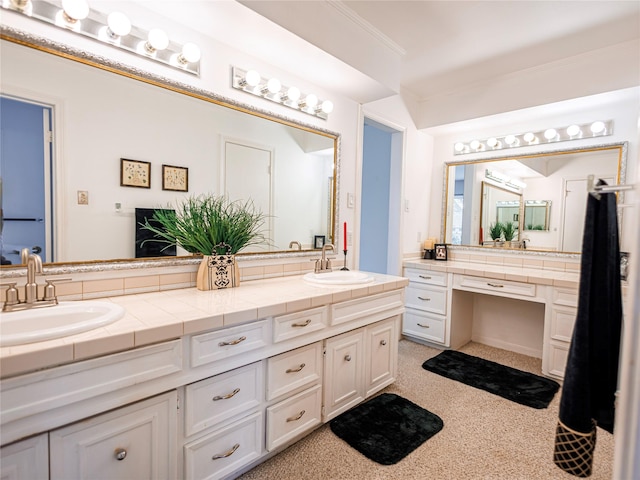 bathroom featuring ornamental molding and vanity