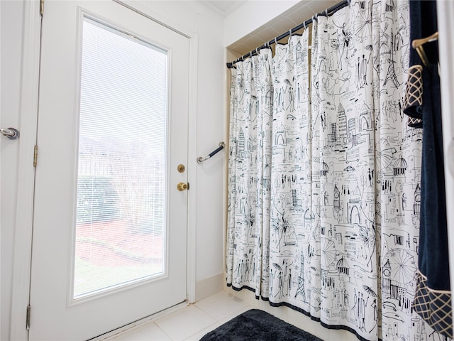 entryway featuring light tile patterned flooring