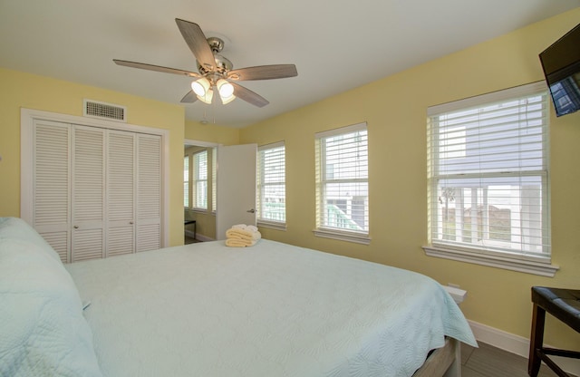 bedroom featuring ceiling fan and a closet