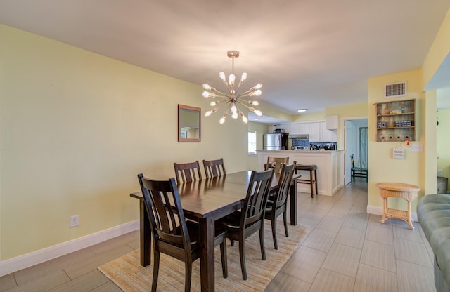 dining room with a notable chandelier