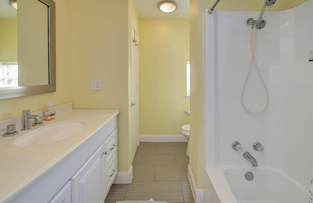 full bathroom with vanity, bathing tub / shower combination, and toilet