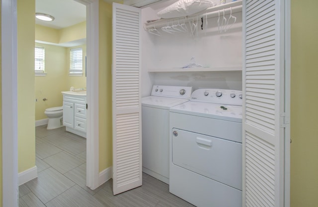 clothes washing area featuring washing machine and dryer