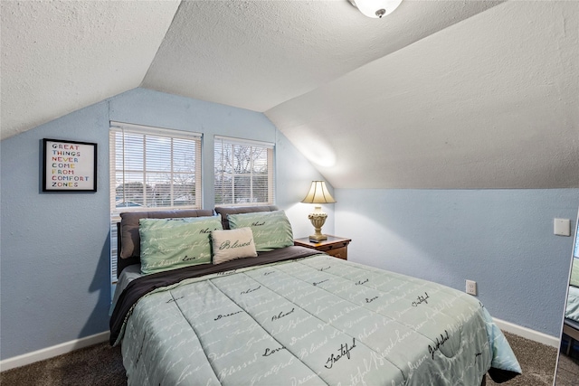 carpeted bedroom with lofted ceiling and a textured ceiling