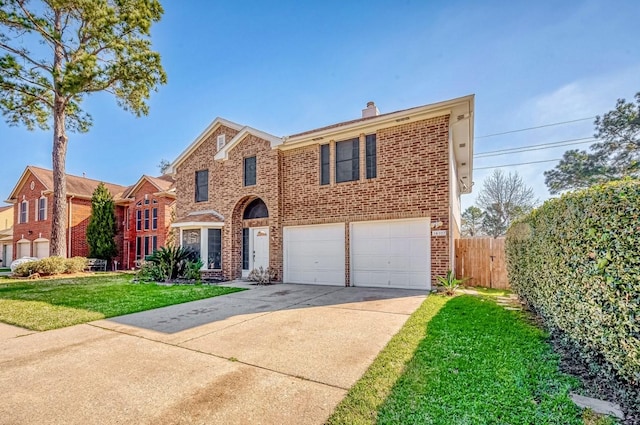 traditional home featuring a front lawn, fence, concrete driveway, a garage, and brick siding