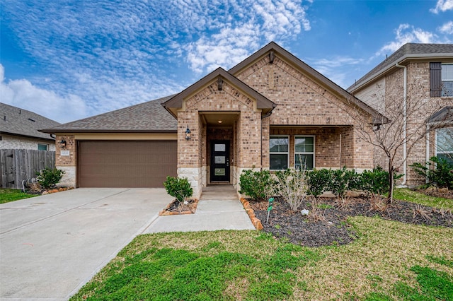 view of front facade with a garage and a front yard