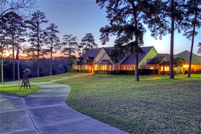 view of front of home with a lawn