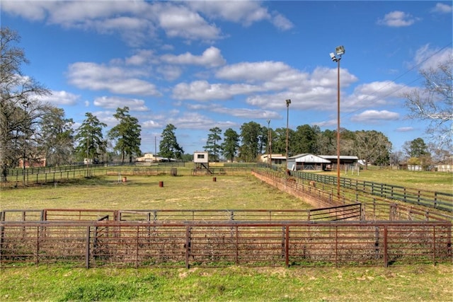 view of yard with a rural view