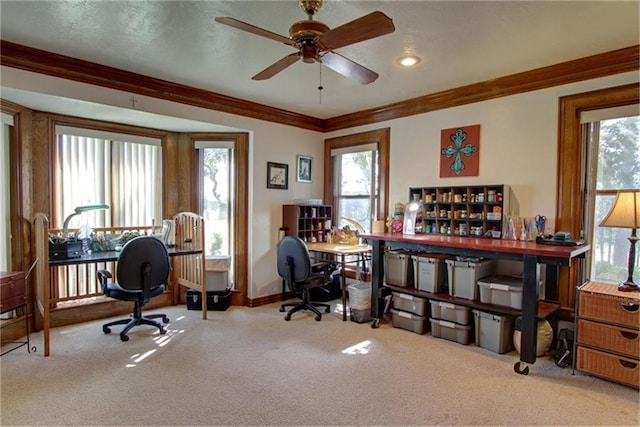 home office featuring crown molding, light colored carpet, and ceiling fan