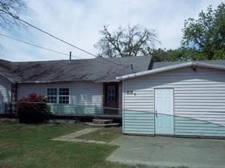 rear view of house with a lawn