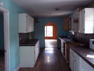 kitchen with white cabinets and dark hardwood / wood-style flooring