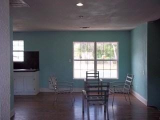 dining room with a wealth of natural light and dark hardwood / wood-style flooring